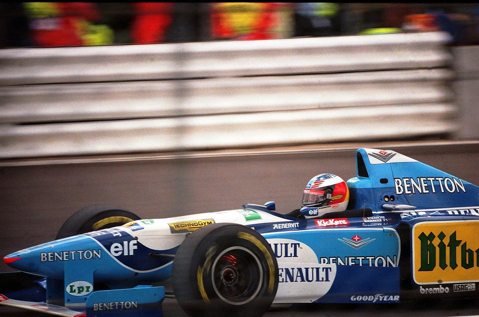 Michael Schumacher in the blue and white Benetton B195 braking for Copse at the 1995 British Grand Prix