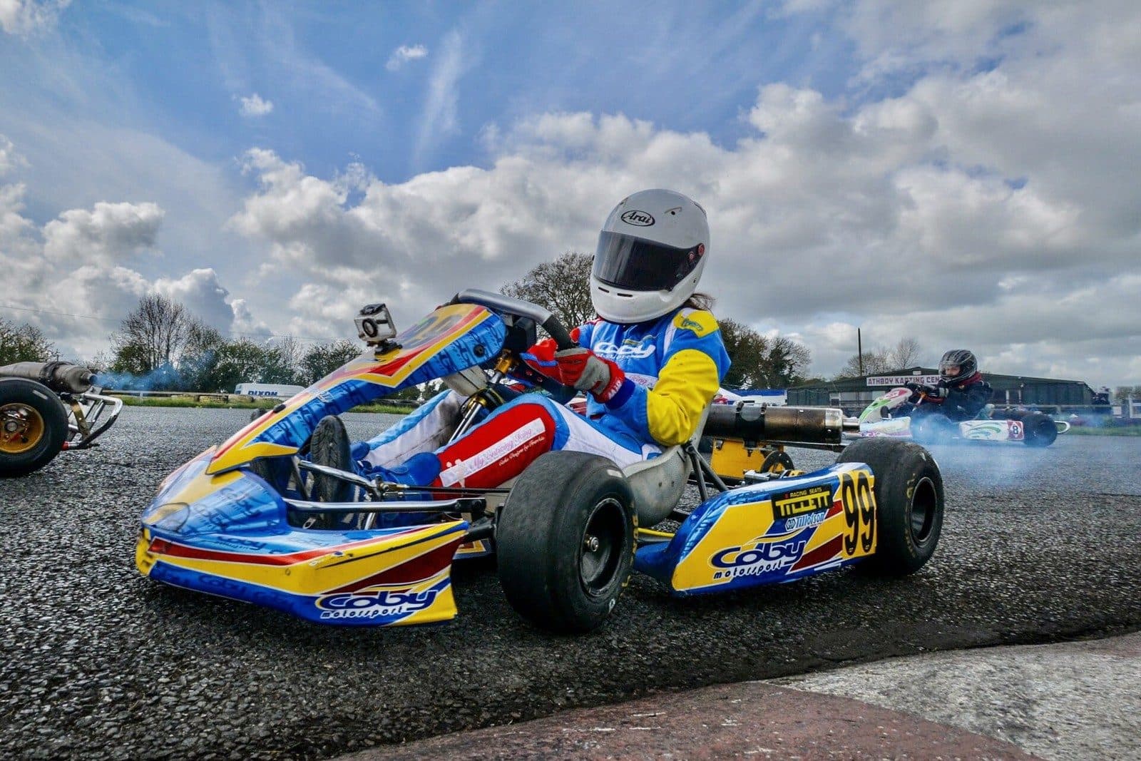 A kart cornering with an action camera mounted on the nose cone in front of the steering wheel