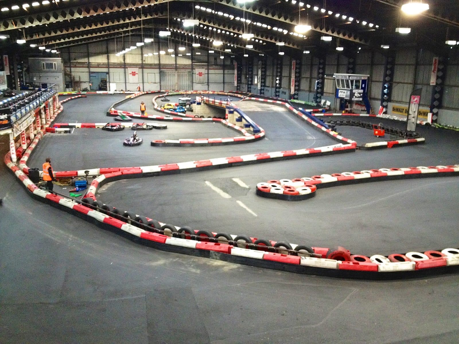 Indoor rental kart track with tyre walls and tight corners